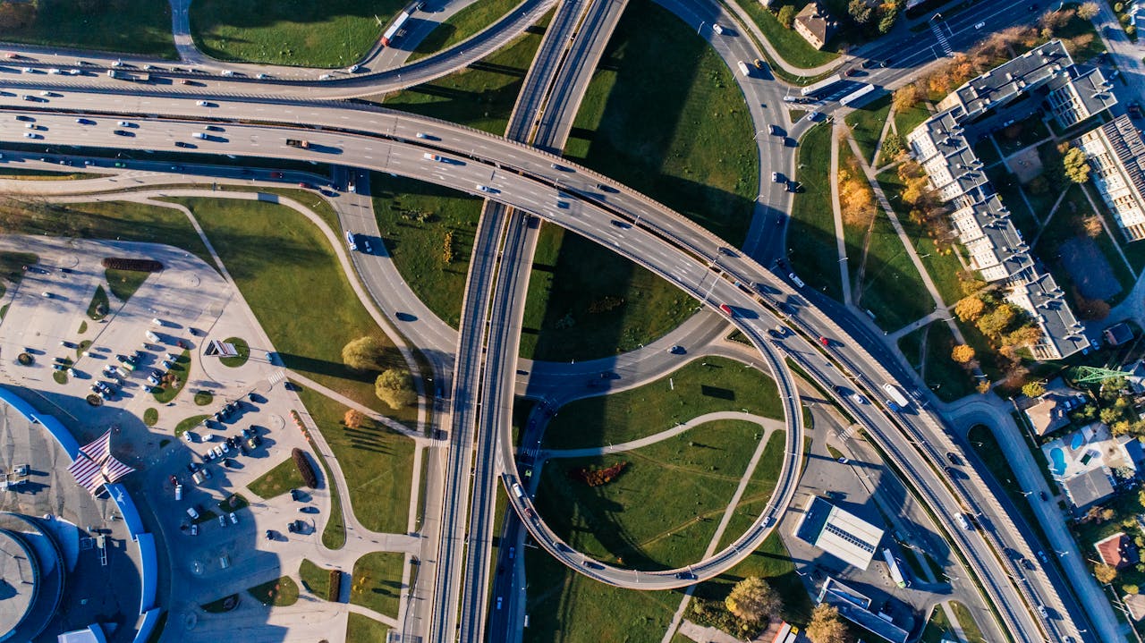 Aerial view of intersecting roads and a looping highway junction